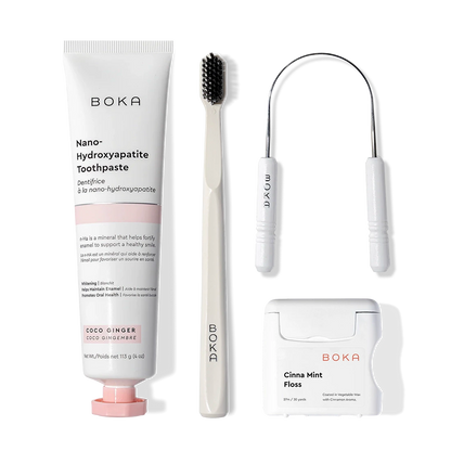The Starter Kit includes nano-hydroxyapatite toothpaste, charcoal toothbrush, tongue cleaner, and floss.