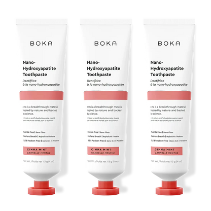Three tubes of Boka Nano-Hydroxyapatite Toothpaste with different flavors on a white background.