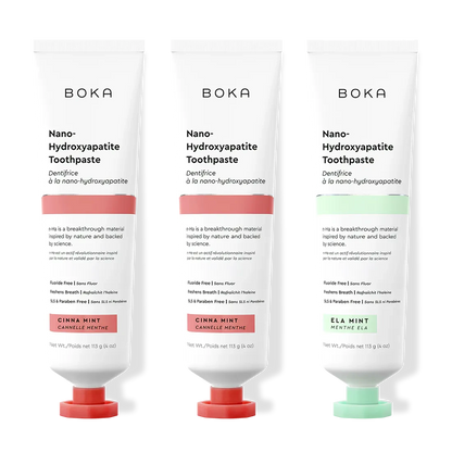 Three tubes of Boka Nano-Hydroxyapatite Toothpaste with different flavors on a white background.