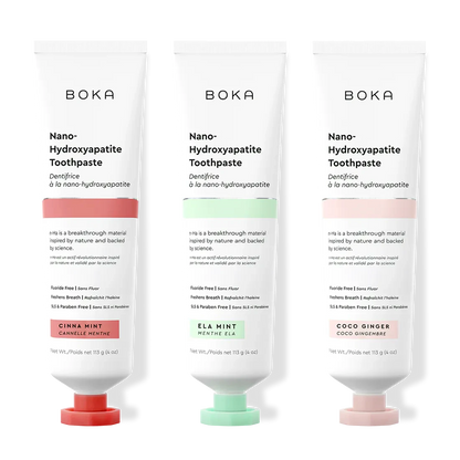 Three tubes of Boka Nano-Hydroxyapatite Toothpaste with different flavors on a white background.