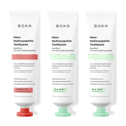 Three tubes of Boka Nano-Hydroxyapatite Toothpaste with different flavors on a white background.