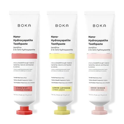 Three tubes of Boka Nano-Hydroxyapatite Toothpaste with different flavors on a white background.
