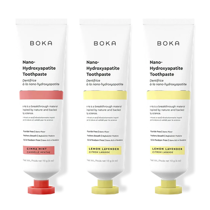 Three tubes of Boka Nano-Hydroxyapatite Toothpaste with different flavors on a white background.
