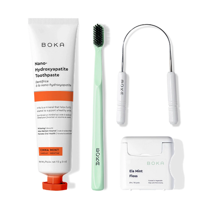 Boka Starter Kit with toothpaste, tongue cleaner, toothbrush, and floss on a white background.