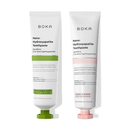 The n-Ha Toothpaste 2-Pack, in cucumber mint and coco ginger, stands on a black background.