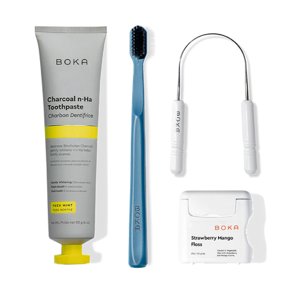 Starter Kit: nano-hydroxyapatite toothpaste, blue toothbrush, tongue scraper, and mango floss.