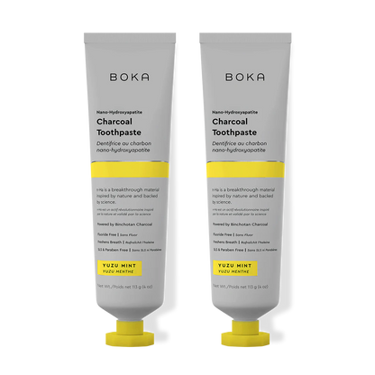 Two tubes of Boka Charcoal Toothpaste on a white background