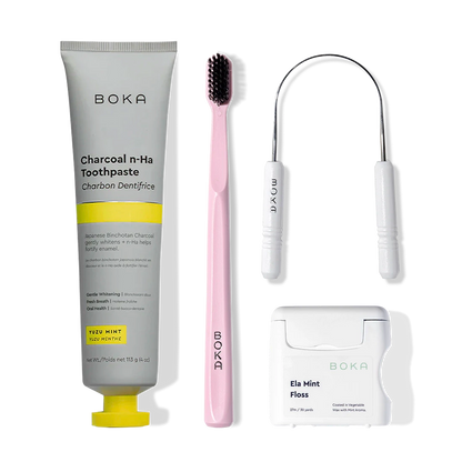 The Starter Kit includes toothpaste, a pink charcoal toothbrush, tongue scraper, and mint floss.