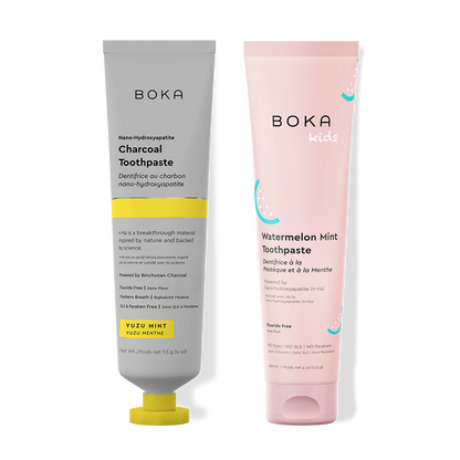 Two Boka toothpaste tubes, one gray and one pink, on a white background.