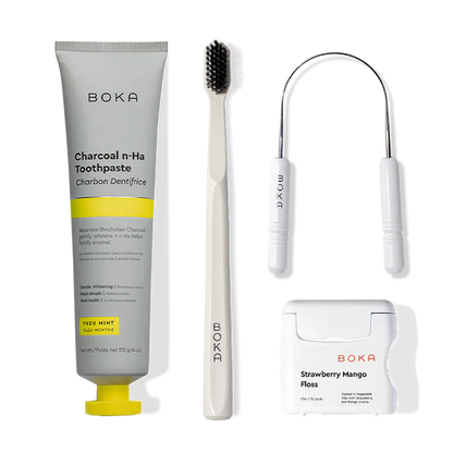 Starter Kit: nano-hydroxyapatite toothpaste & charcoal toothbrush on a white background.