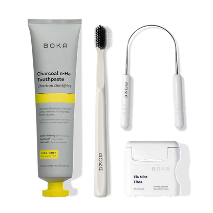 Starter Kit with nano-hydroxyapatite toothpaste, toothbrush, floss & tongue cleaner on white background.