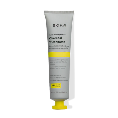A tube of Charcoal Yuzu Mint n-Ha Toothpaste with a yellow and gray design.