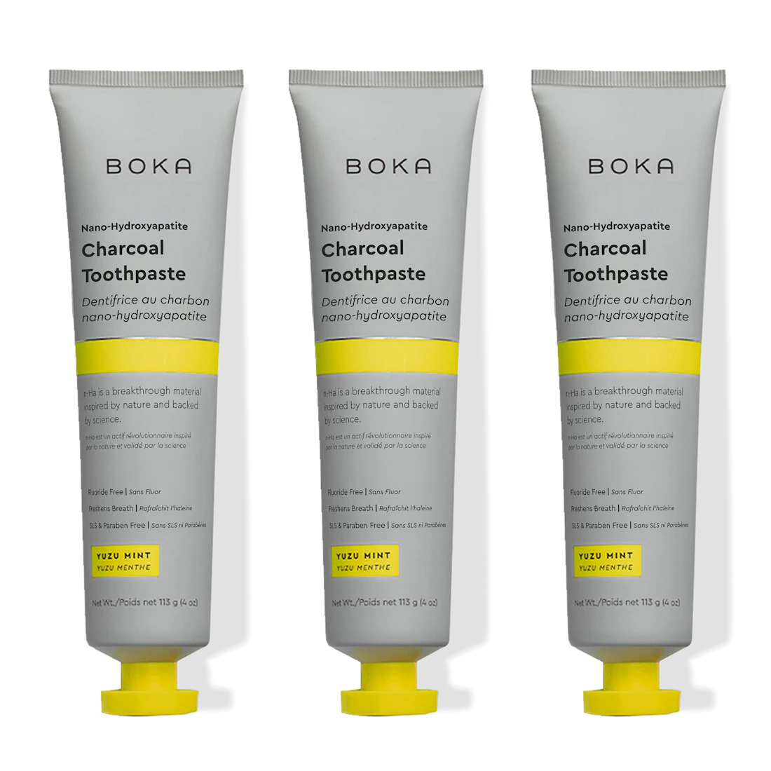 Three tubes of Boka Charcoal Toothpaste with yellow accents on a white background
