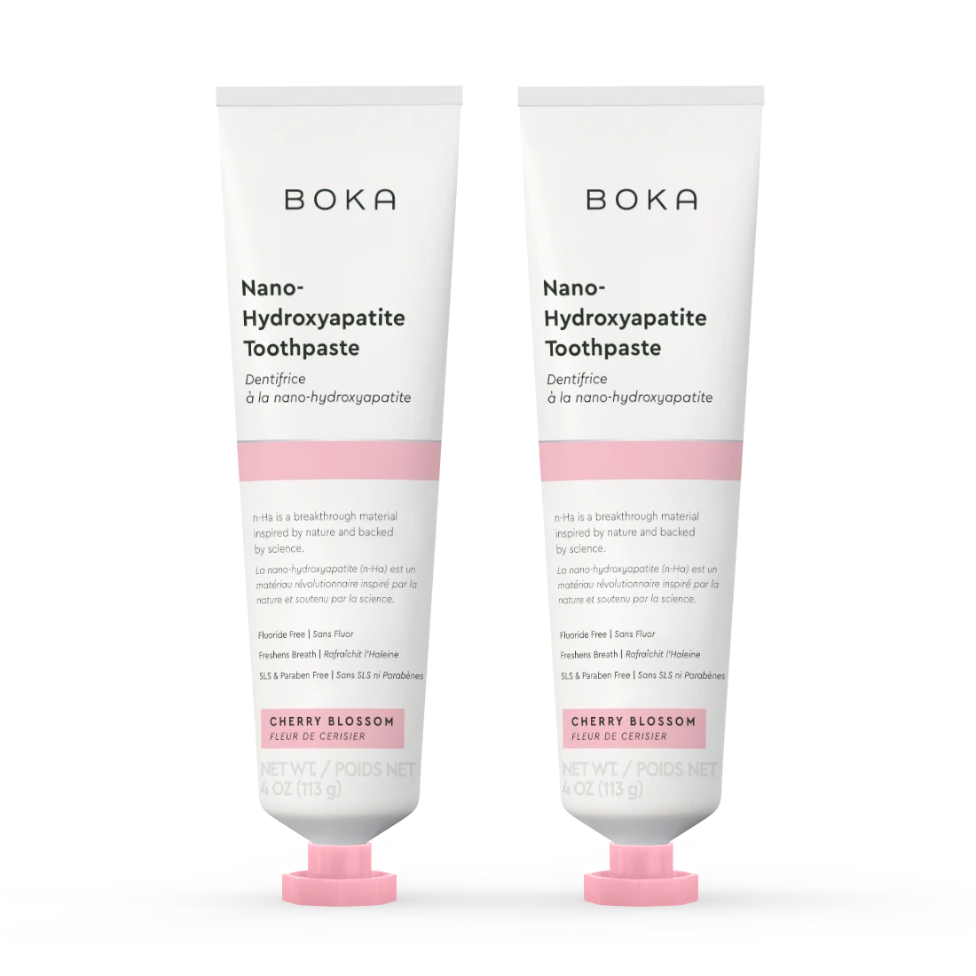 Two tubes of Boka Nano-Hydroxyapatite Toothpaste with cherry blossom flavor on a white background