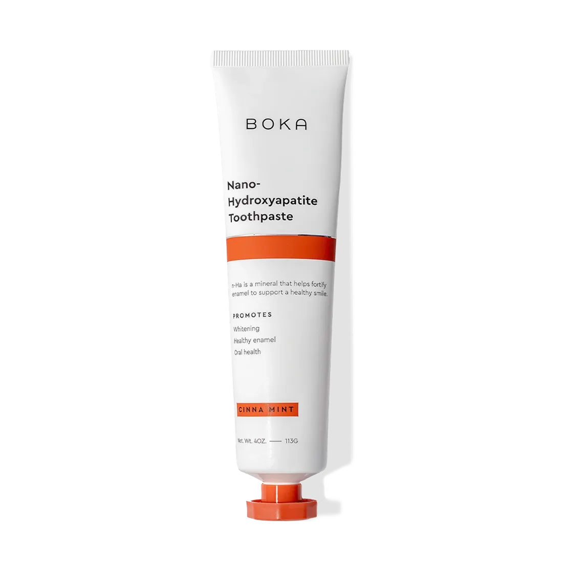 A white and orange tube of Cinna Mint n-Ha Toothpaste with nano-hydroxyapatite to remineralize teeth.
