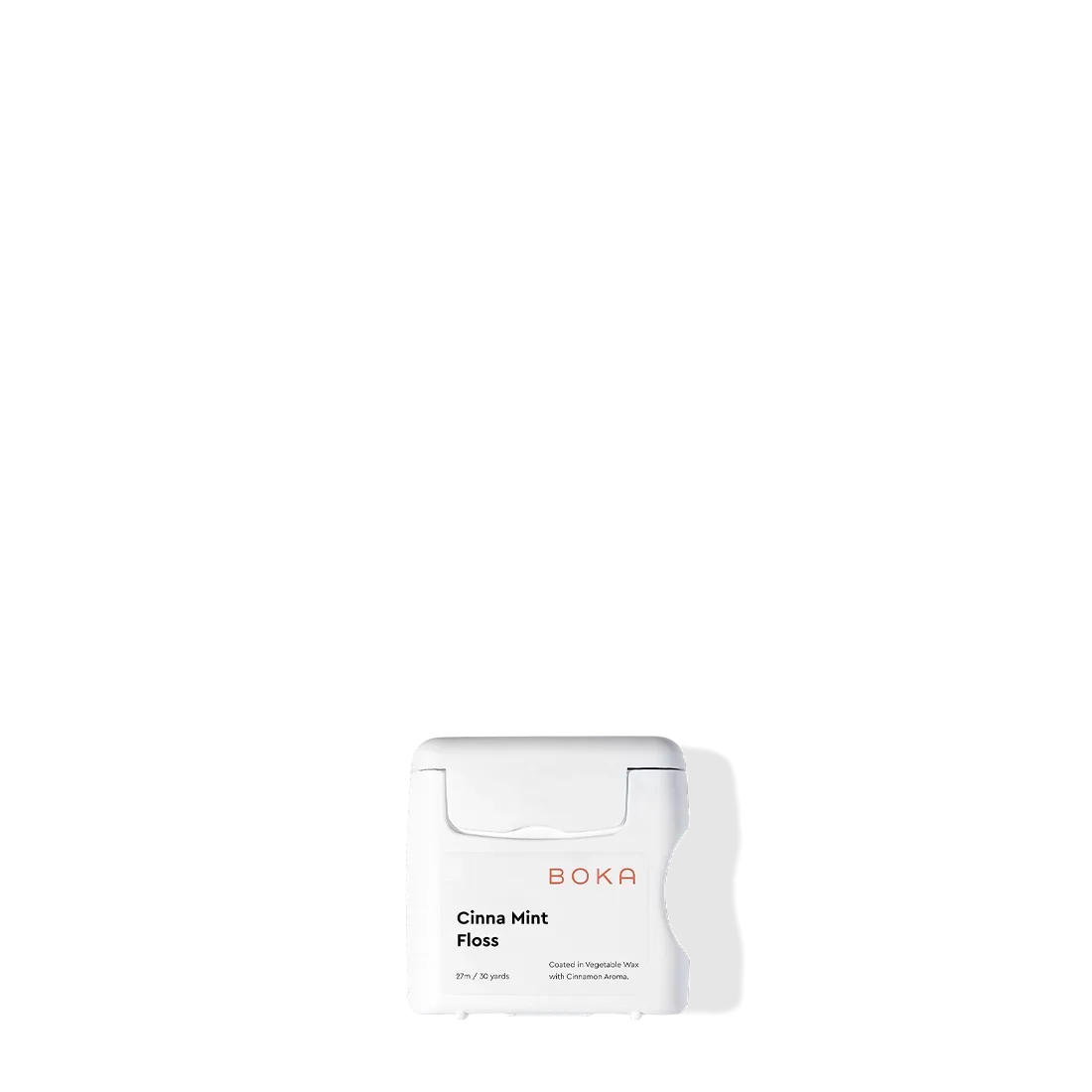 Boka Floss - Cinna Mint with teflon-free natural vegetable wax on a white background and shadow.