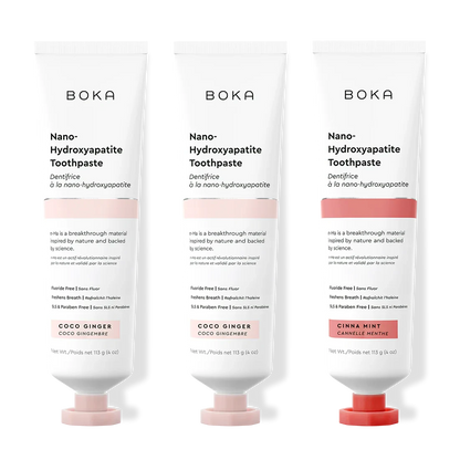 Three tubes of Boka Nano-Hydroxyapatite Toothpaste with different flavors on a white background.
