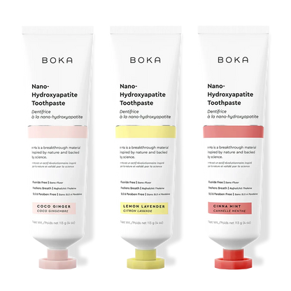 Three tubes of Boka Nano-Hydroxyapatite Toothpaste with different flavors on a white background.