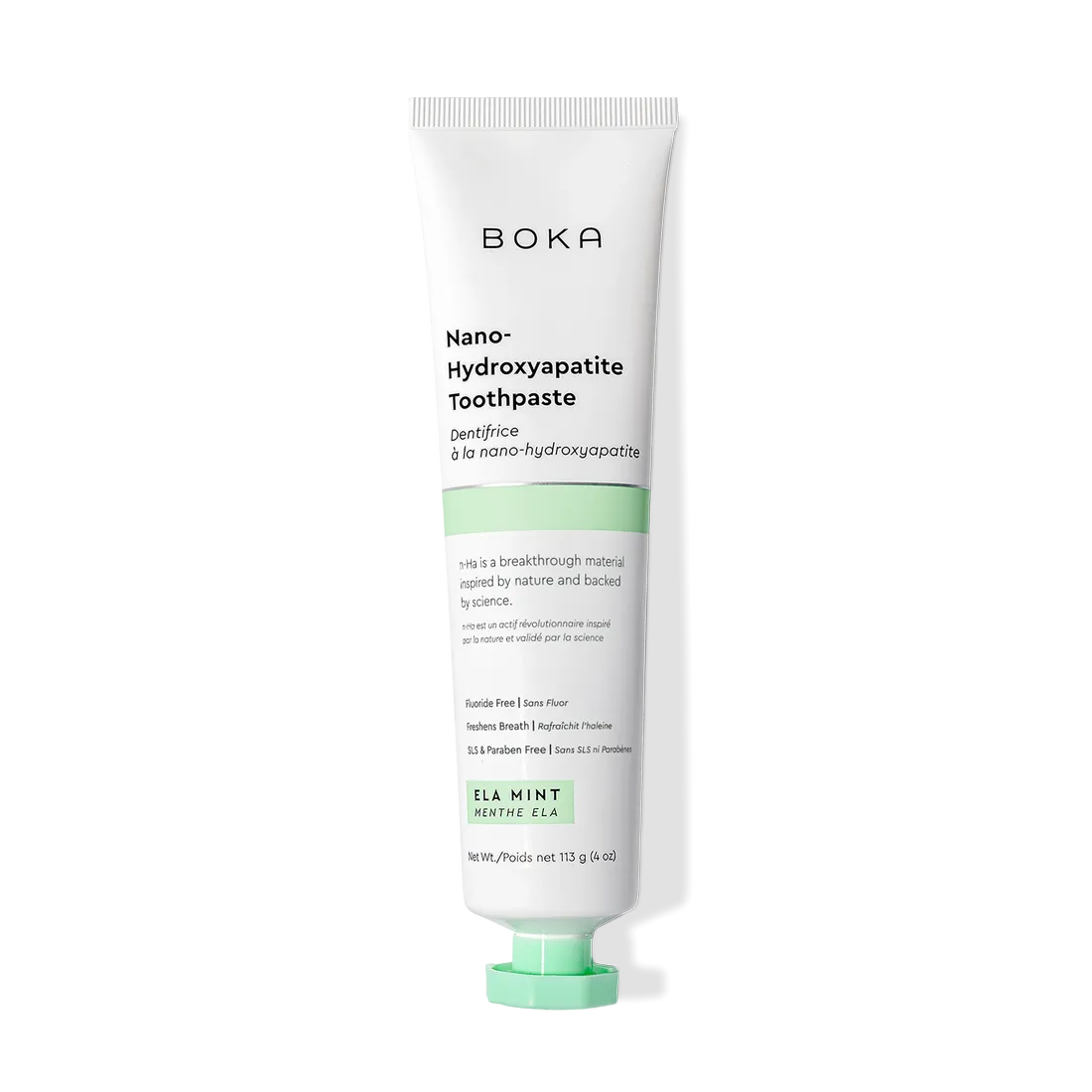 A tube of Ela Mint n-Ha Toothpaste stands upright on a white background.