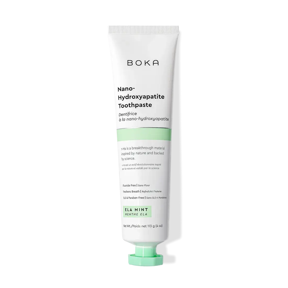 A tube of Ela Mint n-Ha Toothpaste stands upright on a white background.