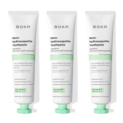 Three tubes of Ela Mint n-Ha Toothpaste stand upright, ideal for daily oral care routines.