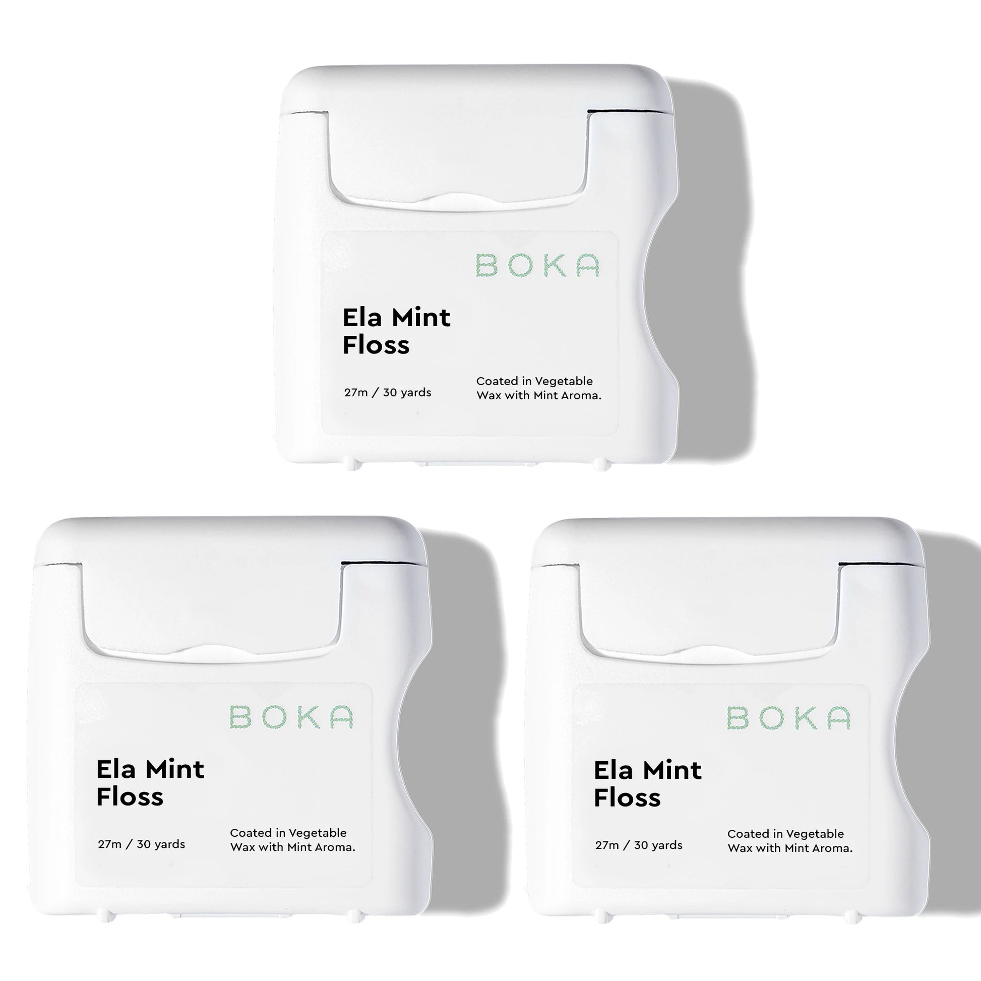 Three packages of Boka Ela Mint Floss on a white background