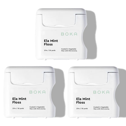 Three packages of Boka Ela Mint Floss on a white background