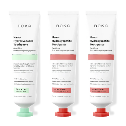 Three tubes of Boka Nano-Hydroxyapatite Toothpaste with different flavors on a white background.