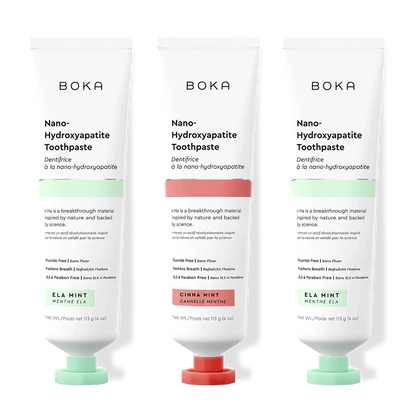 Three tubes of Boka Nano-Hydroxyapatite Toothpaste with different flavors on a white background.