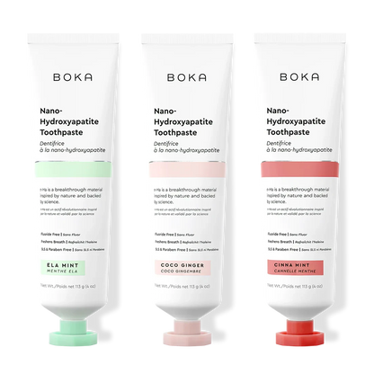 Three tubes of Boka Nano-Hydroxyapatite Toothpaste with different flavors on a white background.