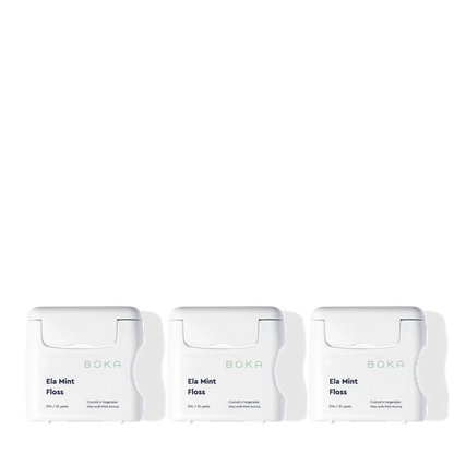 Three packages of Boka Ela Mint Floss on a white background