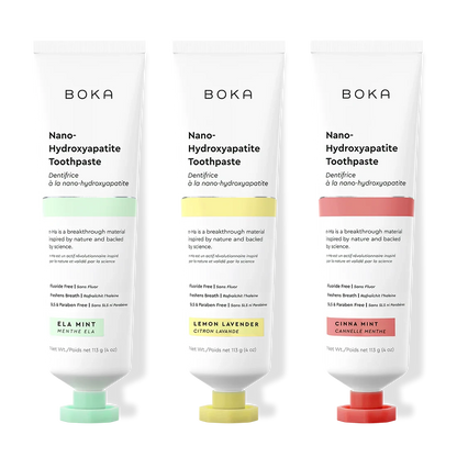 Three tubes of Boka Nano-Hydroxyapatite Toothpaste with different flavors on a white background.