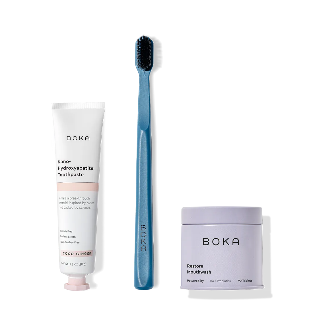 Fresh on the Go: nano-hydroxyapatite toothpaste, charcoal bristle brush, and mouthwash tablets on white.
