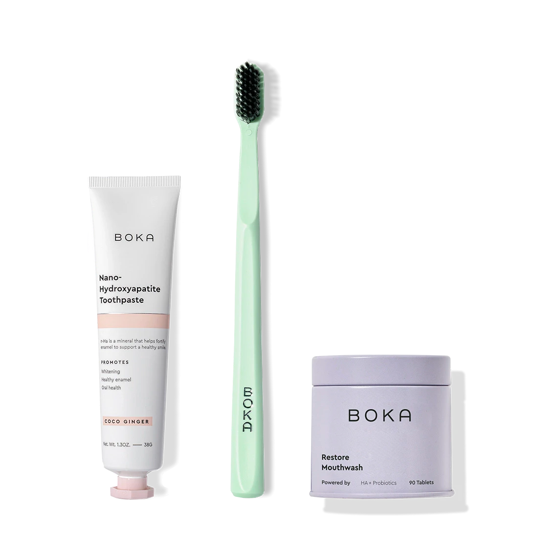 Fresh on the Go nano-hydroxyapatite toothpaste, green toothbrush, and mouthwash tablets on white.