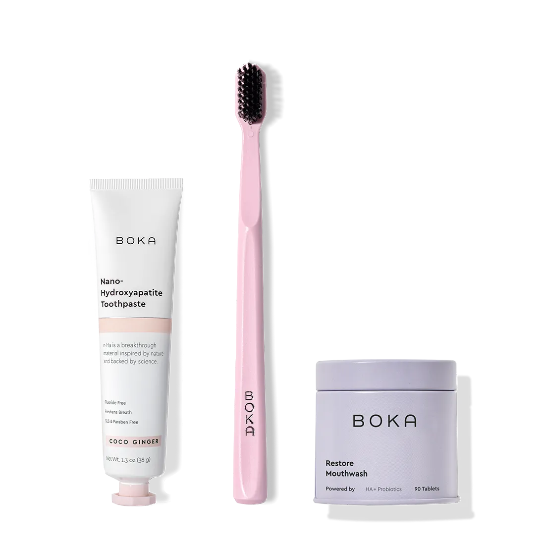Fresh on the Go: nano-hydroxyapatite toothpaste, charcoal bristle brush, and mouthwash tablets on white.