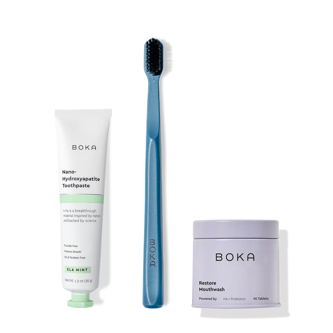 Fresh on the Go: nano-hydroxyapatite toothpaste, charcoal bristle brush, and mouthwash tablets on white.