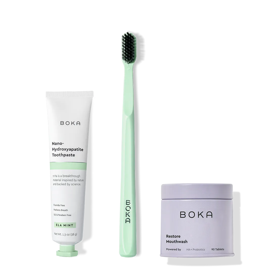 Fresh on the Go: nano-hydroxyapatite toothpaste, charcoal bristle brush, and mouthwash tablets on white.