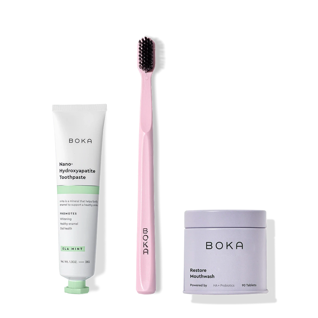 Fresh on the Go: toothpaste tube, pink charcoal-bristle toothbrush, and mouthwash tablets on white.