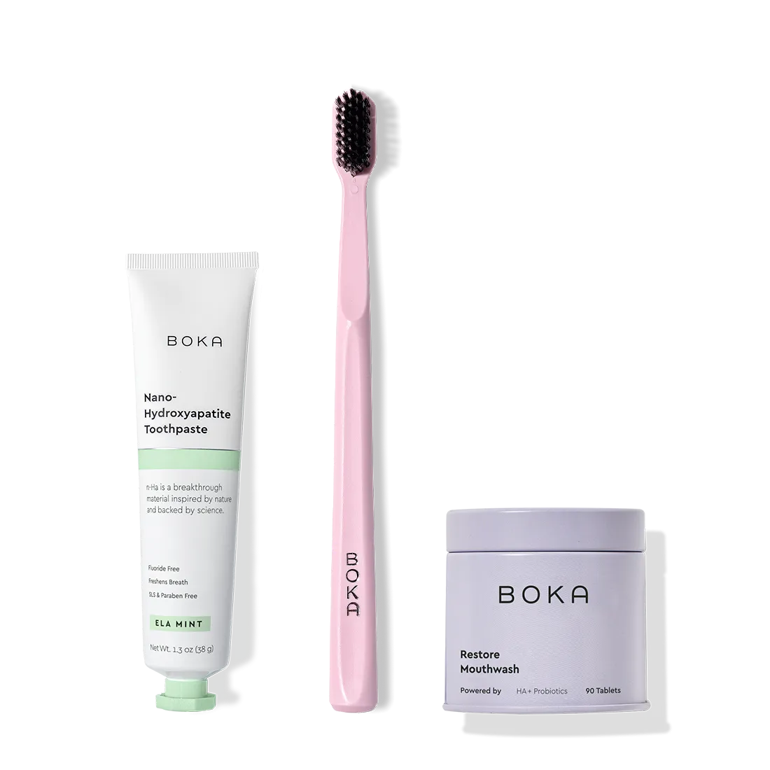 Fresh on the Go: nano-hydroxyapatite toothpaste, charcoal bristle brush, and mouthwash tablets on white.