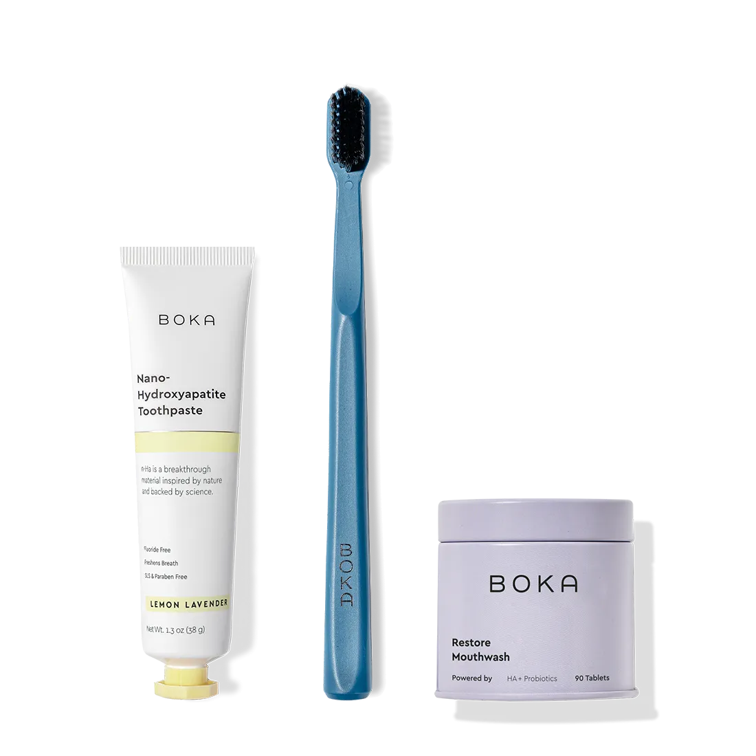 Fresh on the Go: nano-hydroxyapatite toothpaste, charcoal bristle brush, and mouthwash tablets on white.