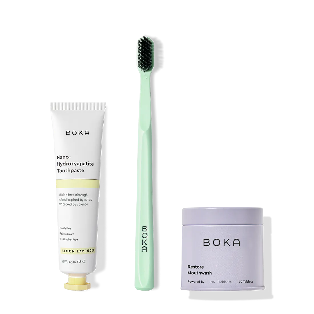 Fresh on the Go: nano-hydroxyapatite toothpaste, charcoal bristle brush, and mouthwash tablets on white.