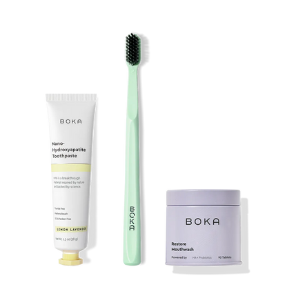 Fresh on the Go: nano-hydroxyapatite toothpaste, charcoal bristle brush, and mouthwash tablets on white.