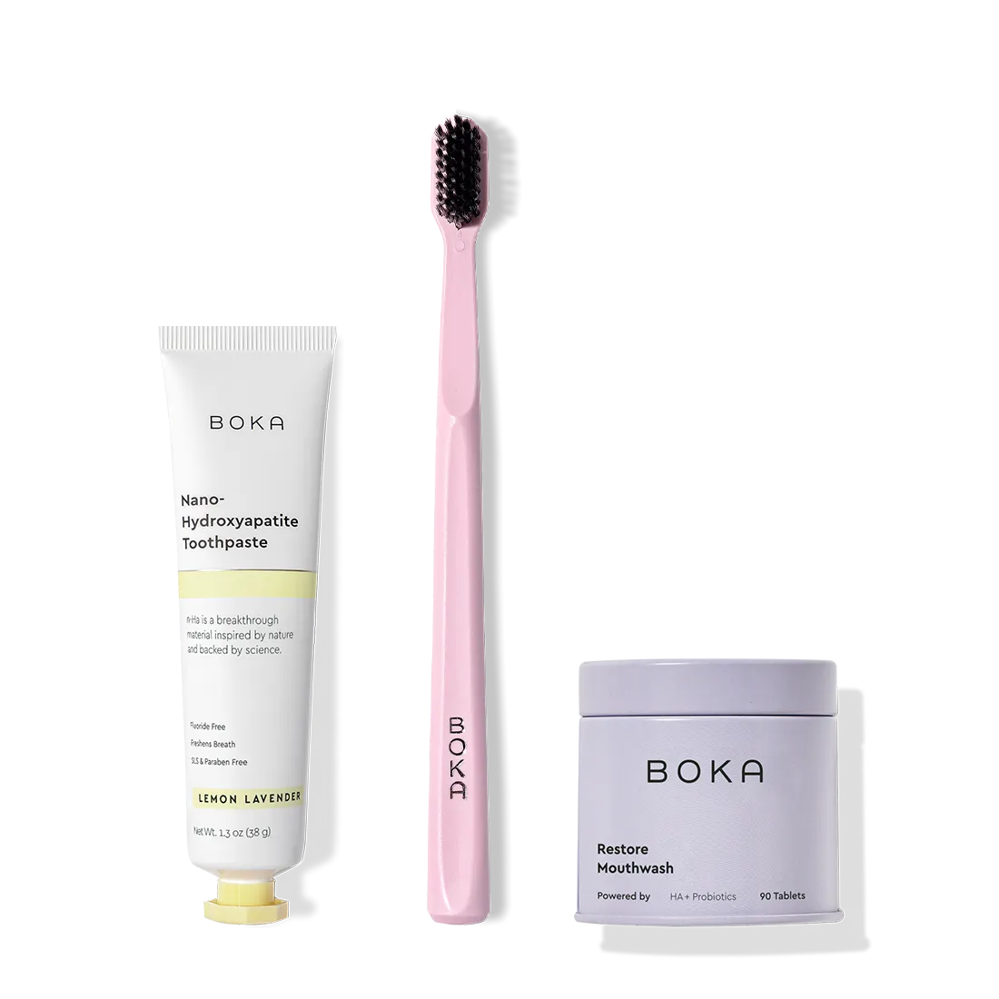 Fresh on the Go: nano-hydroxyapatite toothpaste, charcoal bristle brush, and mouthwash tablets on white.