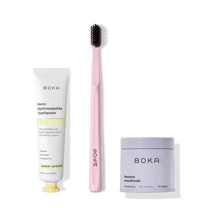 Fresh on the Go: nano-hydroxyapatite toothpaste, charcoal bristle brush, and mouthwash tablets on white.
