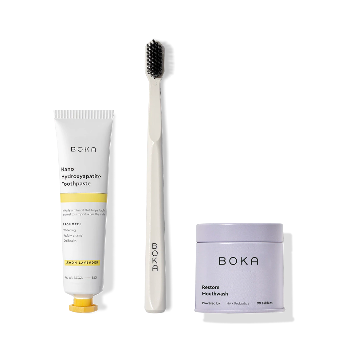 Fresh on the Go: nano-hydroxyapatite toothpaste, charcoal bristle brush, and mouthwash tablets on white.