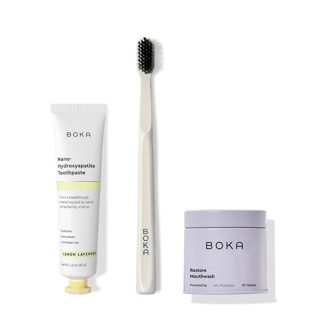 Fresh on the Go: nano-hydroxyapatite toothpaste, charcoal bristle brush, and mouthwash tablets on white.