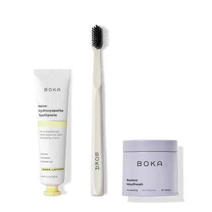Fresh on the Go: nano-hydroxyapatite toothpaste, charcoal bristle brush, and mouthwash tablets on white.
