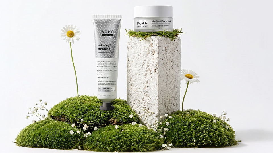 Boka skincare products on a white background with greenery
