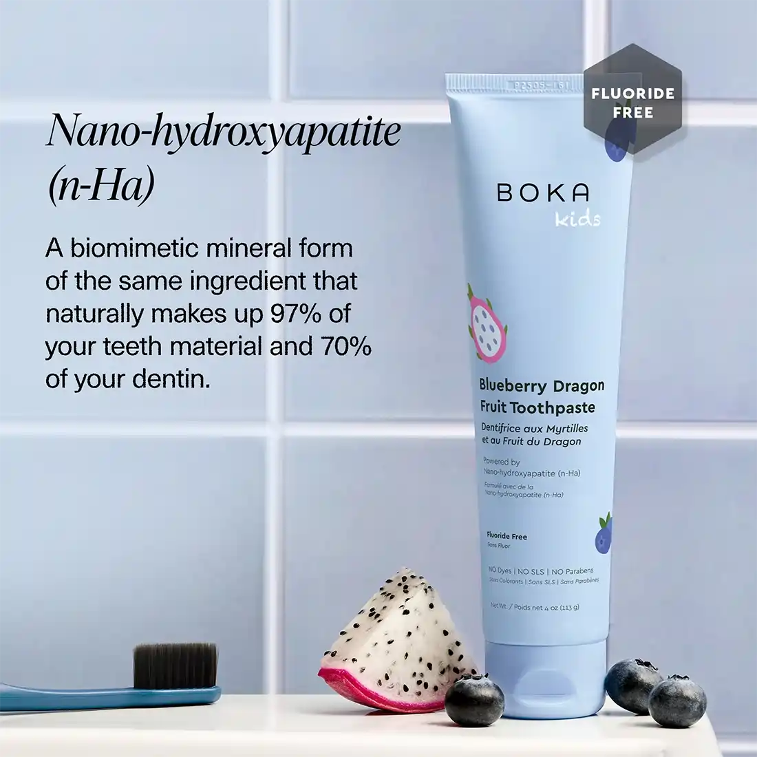 Boka kids blueberry dragon fruit toothpaste with ingredients and benefits text on a tiled wall background