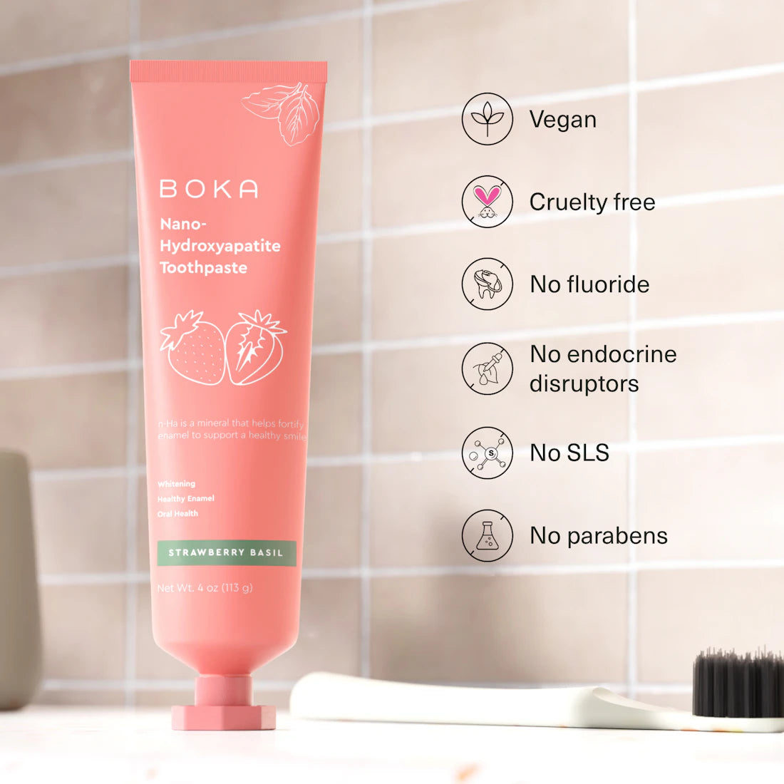 Boka Strawberry Basil n-Ha Toothpaste in a pink tube, fluoride-free and vegan.